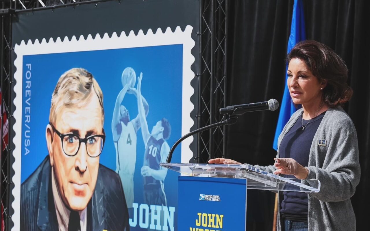 Miss Val Speaking during the unveiling of the John Wooden Stamp